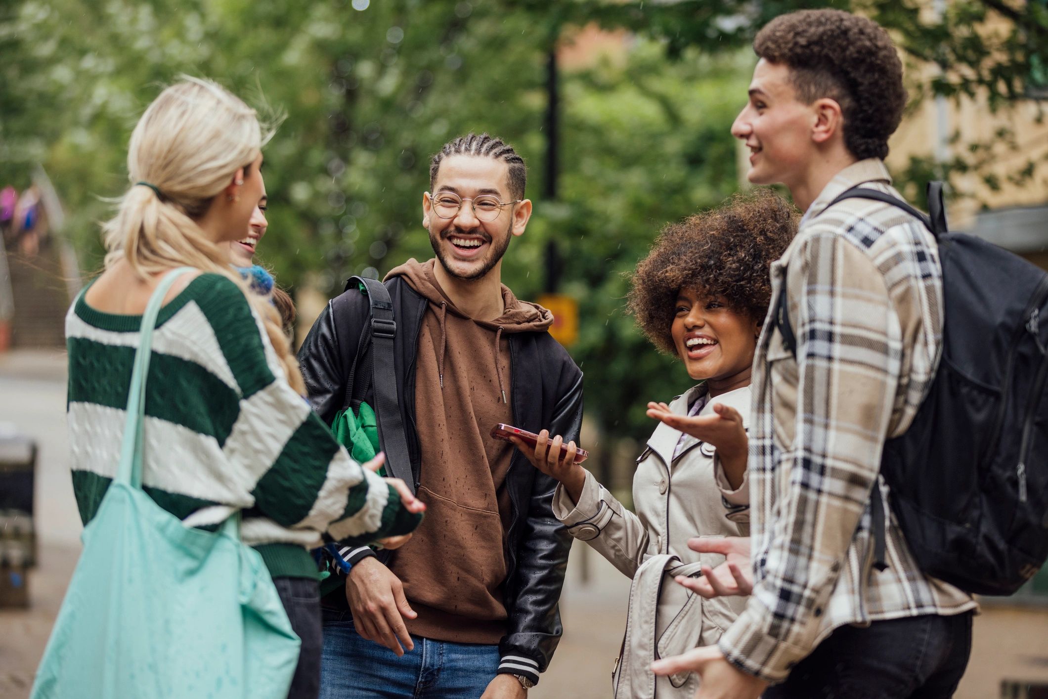 Young group chatting together in streetwear