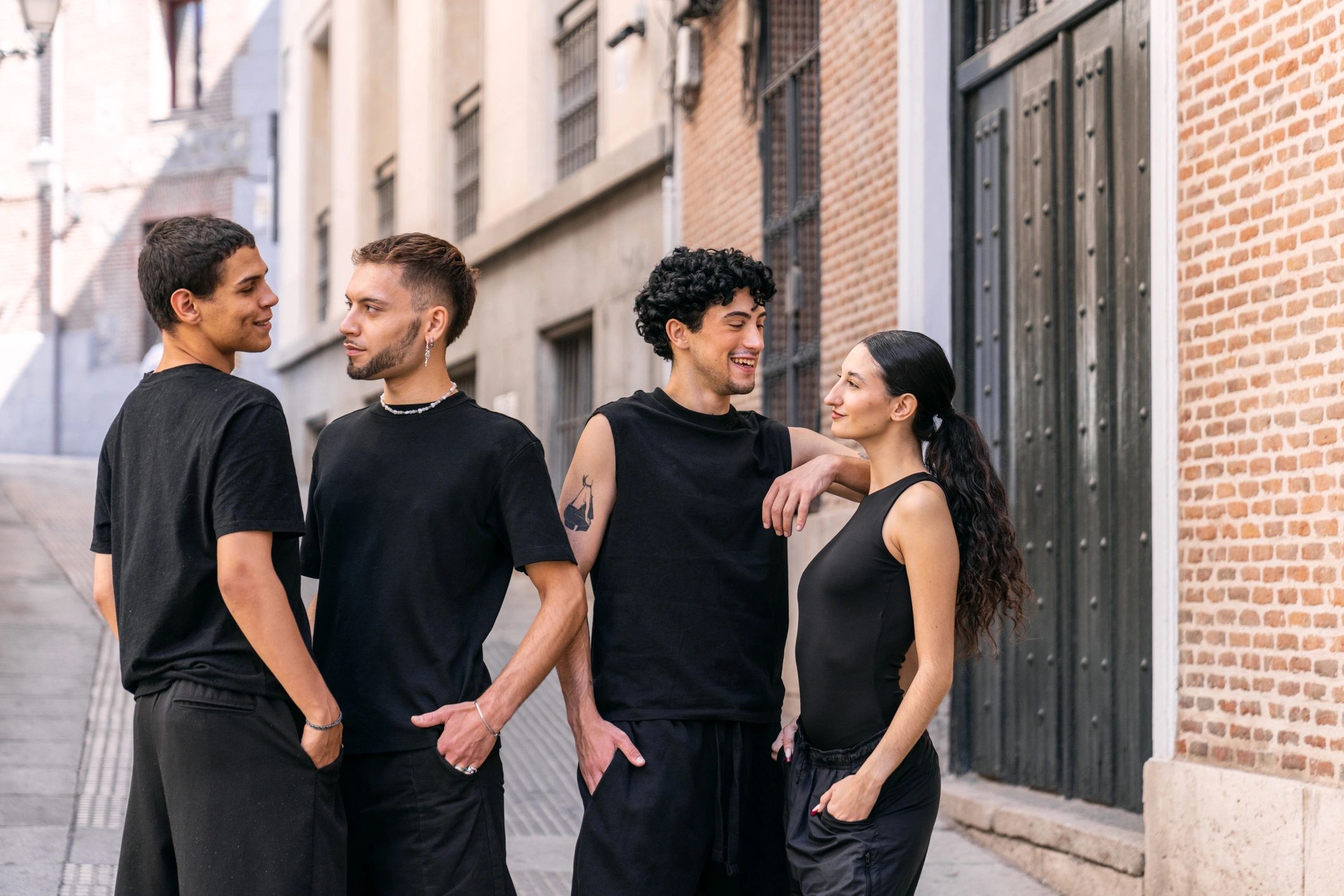 Diverse group in modern streetwear talking on a city street